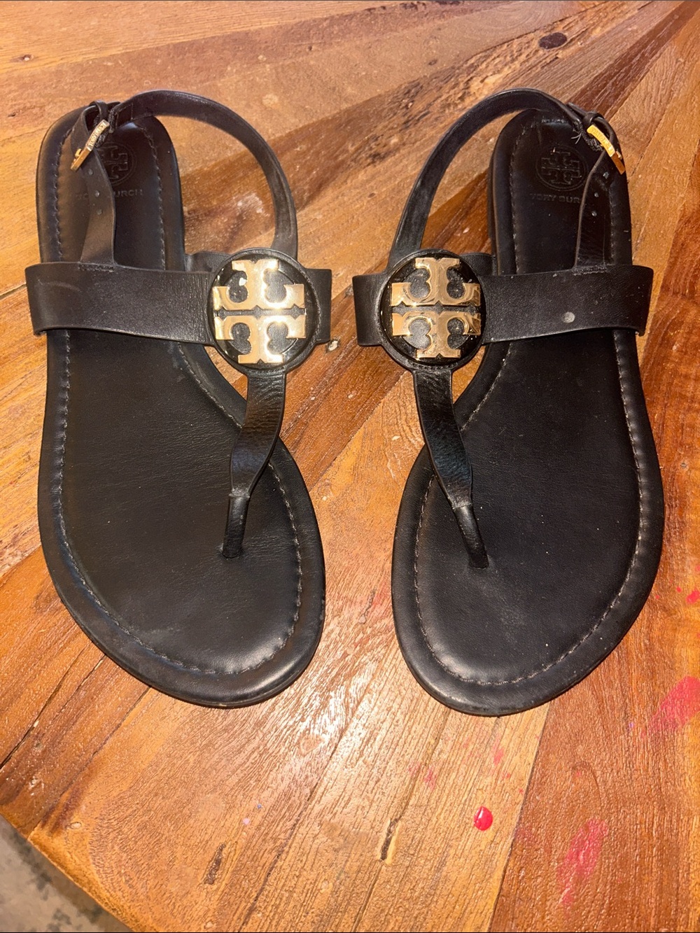 Tory Burch Black Leather T-Strap Sandals with Gold Logo Accents - Picture 3 of 4